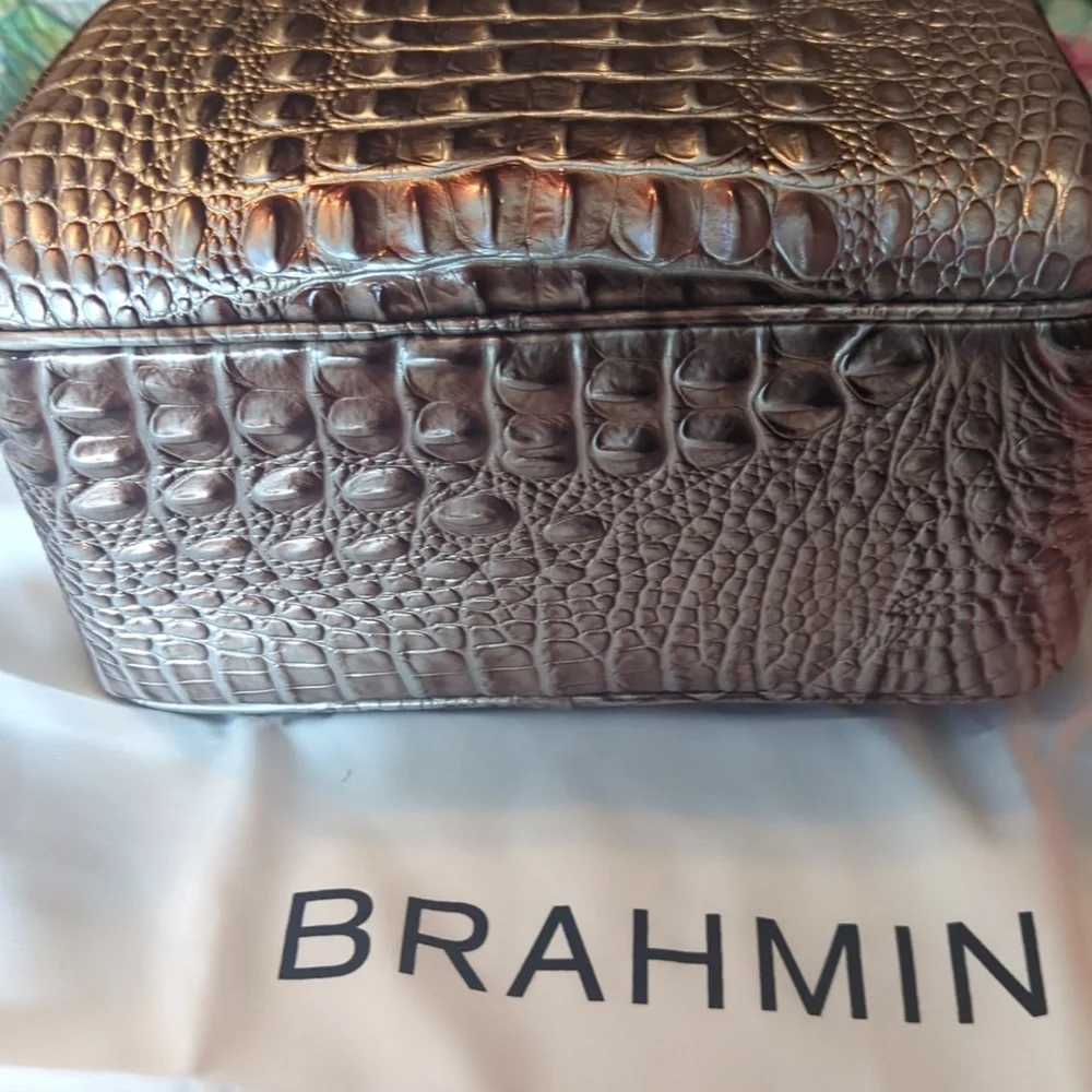Brahmin exterior closure embossed